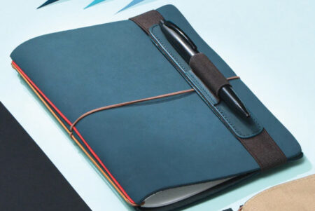 Endless Pen Loop blue colourway on notebook with black pen inside
