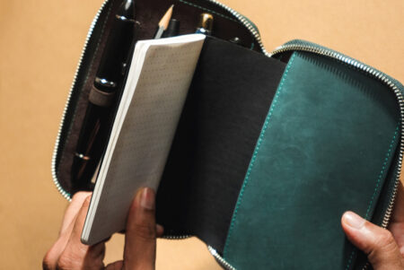 Endless Companion Leather Pen Pouch - Blue 5 pen open with pens and storyboard